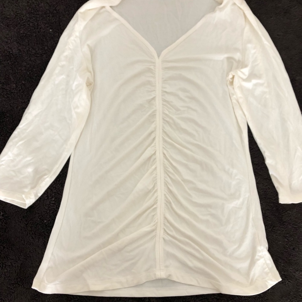 Beige see through top.